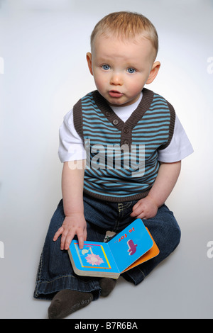 Boy reading alphabet book Stock Photo