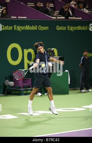 Federer in action against Philipp Kohlschreiber at the Qatar Open 2009