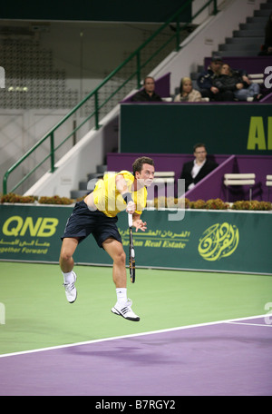 German star Philipp Kohlschreiber serving in the Qatar Open against Roger Federer