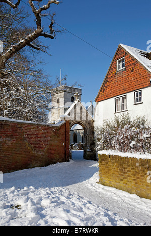 Betchworth Surrey St Michael's churchyard entrance in the snow Stock Photo