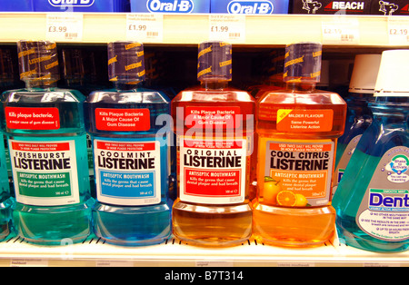 Rows of Listerine, other mouth washes and dental products for sale in a chemist Stock Photo