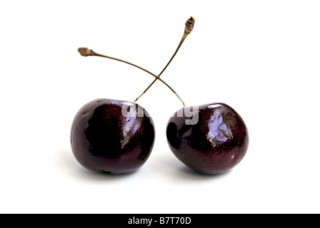 Two fresh cherries on white Stock Photo