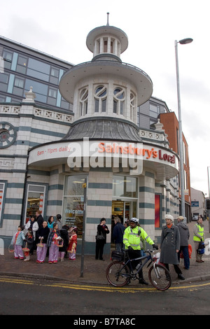 A crowd ouside Sainsburys supermarket at Chinese new year in Sheffield Stock Photo