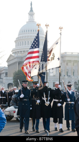 A U.S. Armed Forces color guard marches past the U S Capitol as part of the 2009 inaugural parade for President Barack Obama. Stock Photo