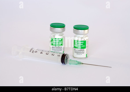 Two vials of Benzyl Penicillin and a syringe with needle Stock Photo