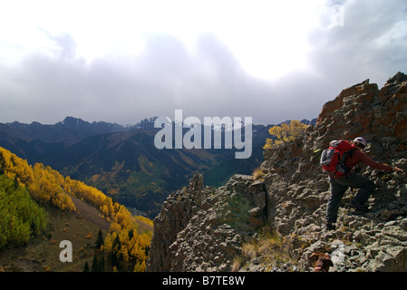 a backpacker on a ridge with his dog high up in the san juan mountains of colorado near telluride Stock Photo