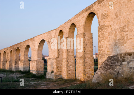 Sunset view of The Kamares Aqeduct in Larnaca, Cyprus Stock Photo