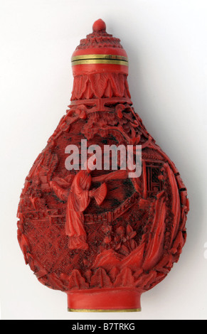 Antique Chinese cinnabar snuff bottle with carvings of woman and scenery Stock Photo