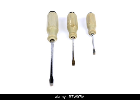 Three Flat head screw drivers against a white background Stock Photo
