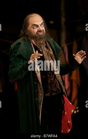 Oliver performing for the press starring Rowan Atkinson as Fagin Stock ...