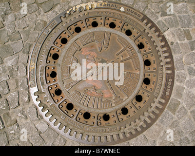 A decorative man hole cover in Berlin Stock Photo