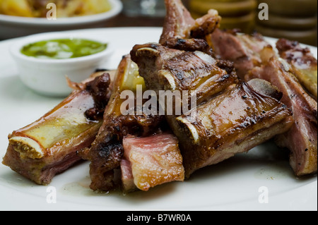 Beef rib Asado South American traditional dish in Argentina Uruguay Chile and Paraguay Stock Photo