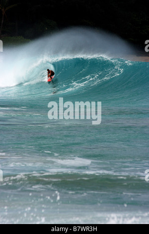 Surfer in the barrel in Tunnel Beach, North Shore of Kauai. Hawaii USA Stock Photo