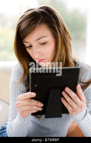 Girl staring at photo Stock Photo