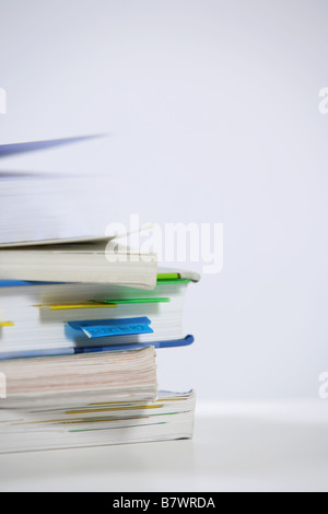 A stack of text books on a desk Stock Photo