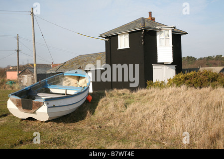 Boathouse and fishing boat Sizewell Suffolk England Stock Photo