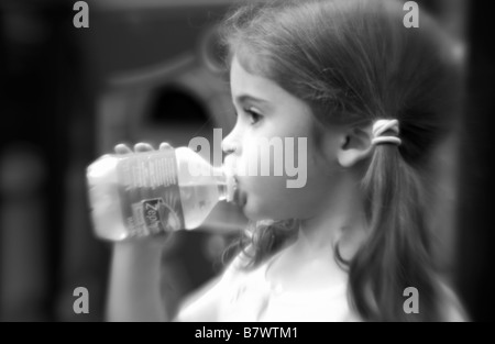 Little Girl Drinking Mineral Water Bottle Stock Photo 85221286