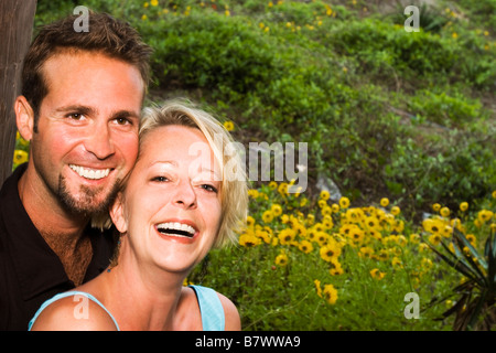 couple holding each other laughing, portrait Stock Photo
