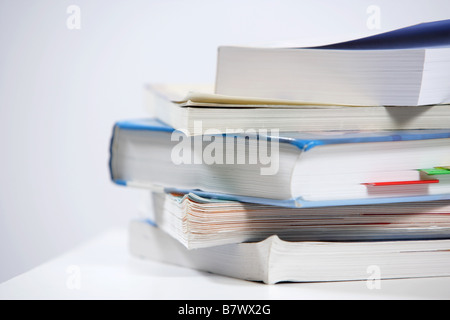 A stack of text books on a desk Stock Photo