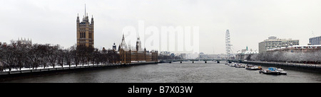 Panoramic view over the river Thames from Lambeth Bridge looking towards Westminster Bridge in the snow. Stock Photo