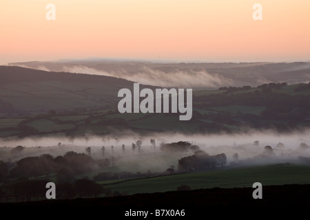 Early morning mist over the Exmoor countryside viewed from Dunkery Hill Exmoor National Park Somerset England Stock Photo