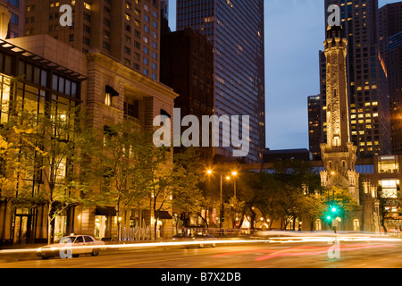 ILLINOIS Chicago Retail stores on Magnificent Mile Water Tower building on Michigan Avenue at dusk Stock Photo