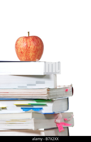 An apple on top of a stack of books  Stock Photo