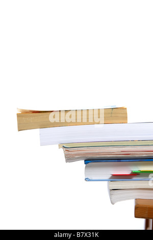Stack of books falling off a school desk Stock Photo