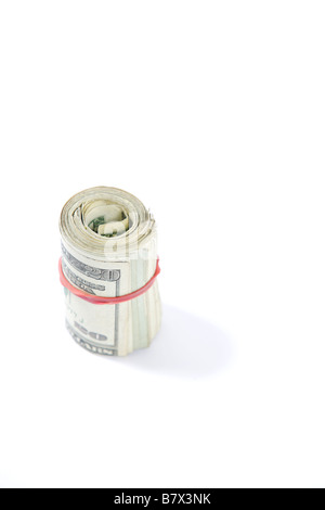 A roll of twenty dollar bills in the studio Stock Photo