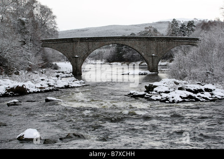 Potarch Bridge over the River Dee near Banchory in Aberdeenshire, Scotland, UK, seen covered in snow during winter Stock Photo