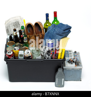 Recycling waste in a black bin Stock Photo