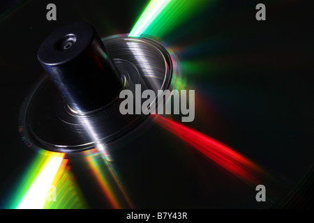 Stack of CD's on a spindle lit with coloured lighting Stock Photo