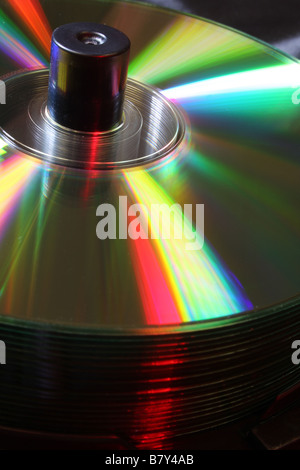 Stack of CD's on a spindle lit with coloured lighting Stock Photo