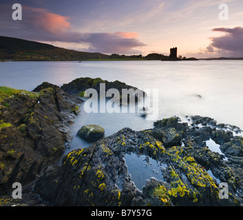 Twilight on the shores of Loch Linnhe near Appin looking out towards the silhouette of Castle Stalker Highlands Scotland Stock Photo