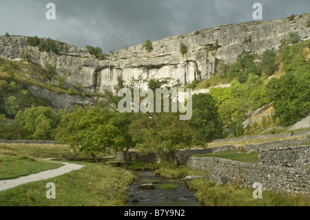 The limestone cliff of Malham Cove in the Yorkshire Dales with a stormy sky Stock Photo