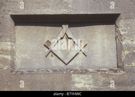 Bruton Somerset UK  symbol sign for Freemasons set square and pair of compasses  carved stone relief on Victorian Masonic hall Stock Photo