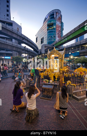 The Erawan buddhist shrine on the forecourt of the upmarket Erawan shopping mall Pathumwan district in central Bangkok Thailand Stock Photo
