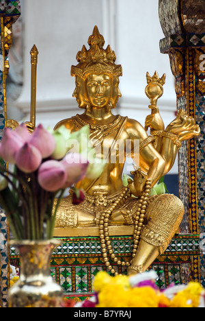 Erawan buddhist shrine on the forecourt of the upmarket Erawan shopping mall Pathumwan district in central Bangkok Thailand Stock Photo
