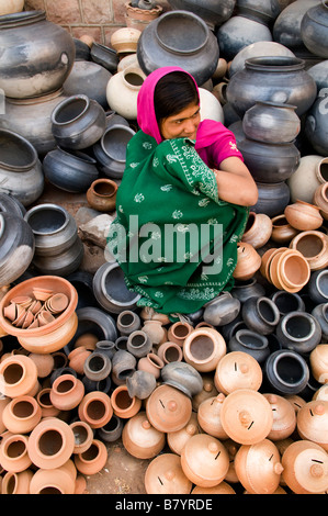 selling clay jars in the old market of Jodhpur, Rajasthan. Stock Photo