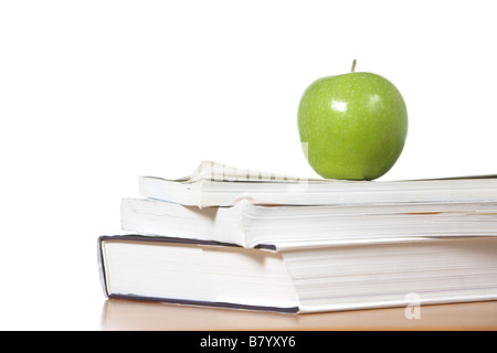 An apple on top of a stack of books  Stock Photo