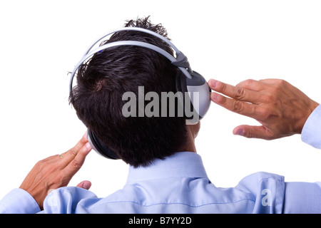 young businessman taking a break feeling the music isolated on white Stock Photo