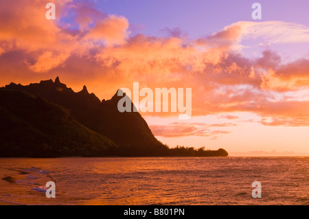 Evening light on Na Pali Coast spires from Tunnels Beach Island of Kauai Hawaii Stock Photo