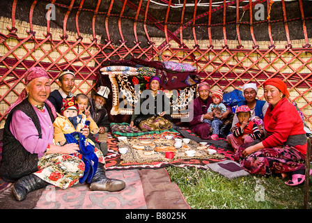 Kyrgyzs family in a yurt Near Irkestan pass Kyrgyzstan Stock Photo