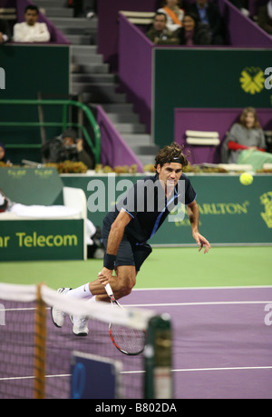 Roger Federer or Switzerland playing Andreas Seppi of Italy on Jan 7 2009 in the Qatar ExxonMobil Open Stock Photo
