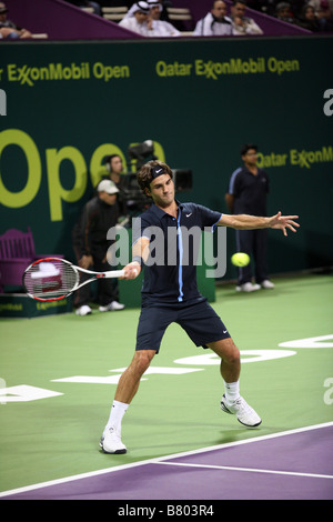 Roger Federer or Switzerland playing Andreas Seppi of Italy on Jan 7 2009 in the Qatar ExxonMobil Open Stock Photo