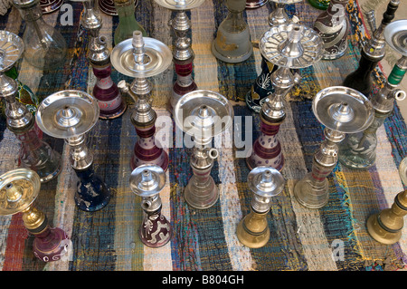 Stack of hookah pipes also known as a water pipe, Narghile,  nargeela, narghileh or nargile popular for smoking in the Arab Middle East Stock Photo