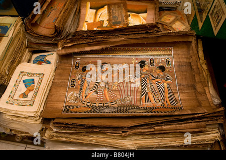 Papyrus manuscripts and paintings “Replica” for sale in a souvenir shop in Khan el-Khalili a major souk in the historic center of Islamic Cairo Egypt Stock Photo