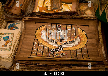 Papyrus manuscripts and paintings “Replica” for sale in a souvenir shop in Khan el-Khalili a major souk in the historic center of Islamic Cairo Egypt Stock Photo