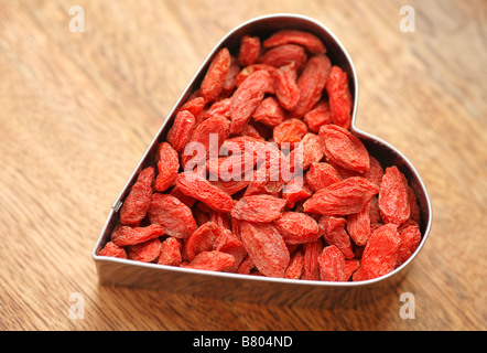 Goji berries in a heart shape Stock Photo
