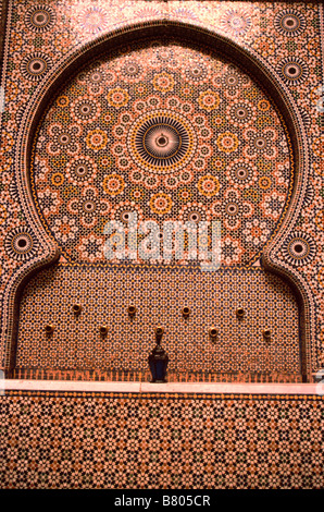 Traditional mosaic tile work, or zellij, on a fountain in the medina/ old town, Fes el-bali, Fez, Morocco Stock Photo